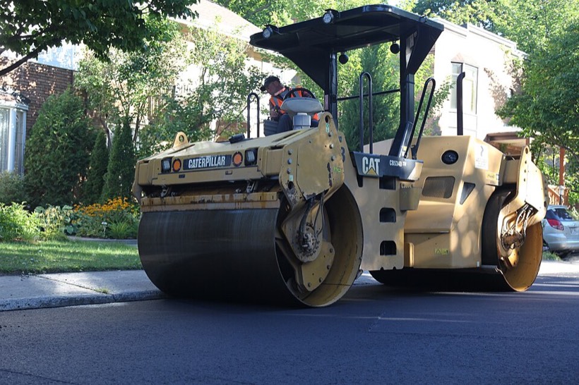 Road roller compacting asphalt